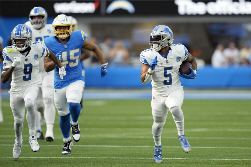 Detroit Lions running back David Montgomery (5) runs for a touchdown during the first half an NFL football game against the Los Angeles Chargers Sunday, Nov. 12, 2023, in Inglewood, Calif. (AP Photo/Ashley Landis)