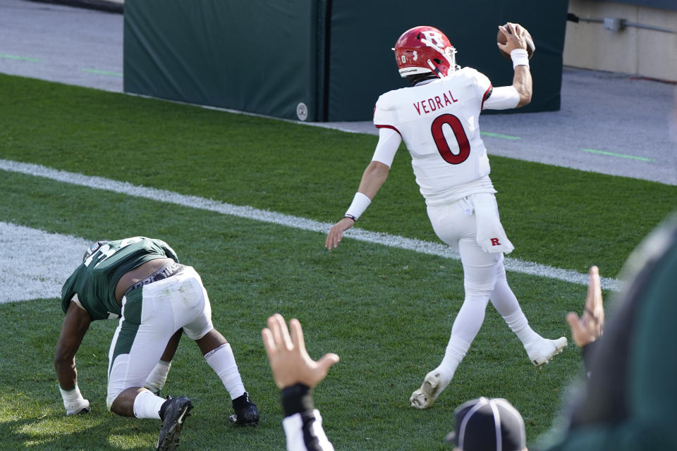 Rutgers quarterback Noah Vedral (0) runs into the end zone for a 24-yard touchdown during the first half of an NCAA college football game against Michigan State, Saturday, Oct. 24, 2020, in East Lansing, Mich. (AP Photo/Carlos Osorio)