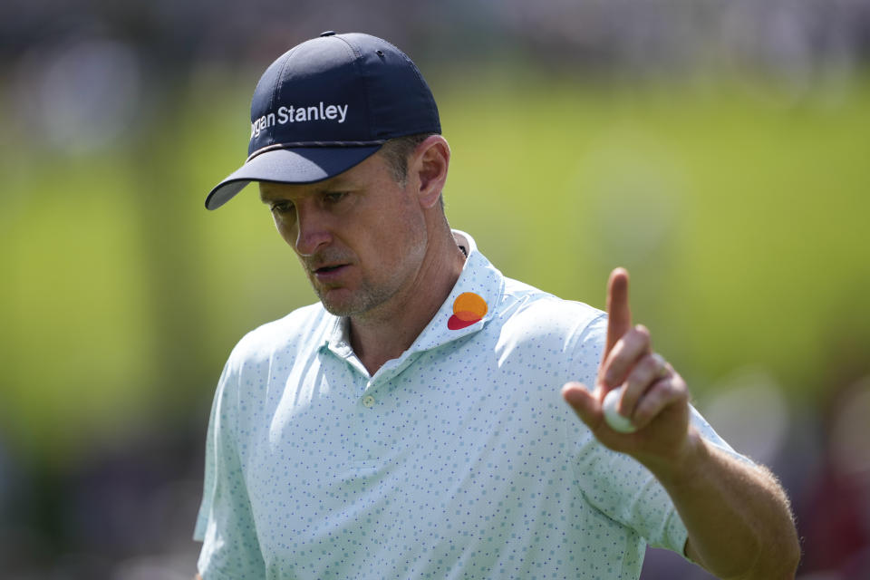 Justin Rose, of England, waves after making a putt on the 15th hole during the third round of the PGA Championship golf tournament at the Valhalla Golf Club, Saturday, May 18, 2024, in Louisville, Ky. (AP Photo/Matt York)