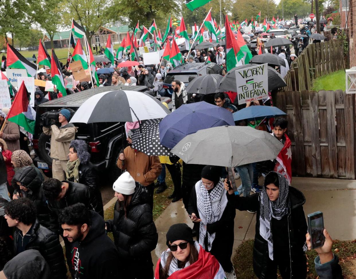 People demonstrate in support of Palestinians on Oct. 14, 2023, in Dearborn, Mich. <a href="https://www.gettyimages.com/detail/news-photo/people-demonstrate-in-support-of-palestinians-in-dearborn-news-photo/1724359826?adppopup=true" rel="nofollow noopener" target="_blank" data-ylk="slk:Jeff Kowalsky/AFP via Getty Images;elm:context_link;itc:0;sec:content-canvas" class="link ">Jeff Kowalsky/AFP via Getty Images</a>