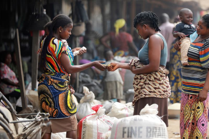 FILE PHOTO: Women buy rice at Wurukum Rice Mill in Makurdi