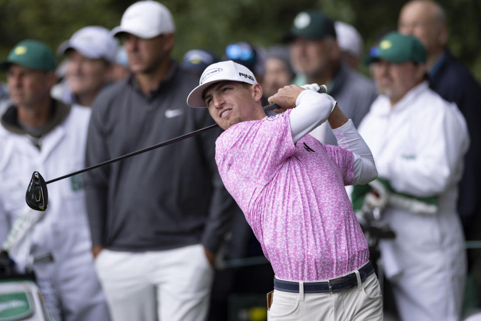 Amateur Sam Bennett of the United States plays a stroke from the No. 14 tee during the continuation of the third round of the 2023 Masters Tournament at Augusta National Golf Club, Sunday, April 9, 2023.