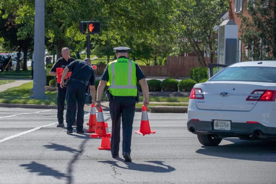 Lexington police removed traffic cones before reopening Nicholasville Road in Lexington on Wednesday after investigating a suspicious package left at a business in the 2100 block.