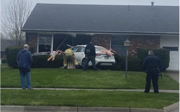 PHOTOS: Car crashes into Springfield living room