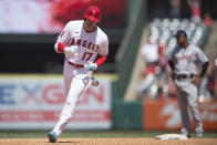 Los Angeles Angels designated hitter Shohei Ohtani pumps his fist after hitting a two-run home run during the fifth inning of a baseball game against the Detroit Tigers in Anaheim, Calif., Sunday, June 20, 2021. (AP Photo/Kyusung Gong)