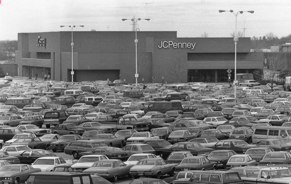 The parking lot is full near J.C. Penney as Christmas shoppers converge on Rolling Acres Mall in 1982.