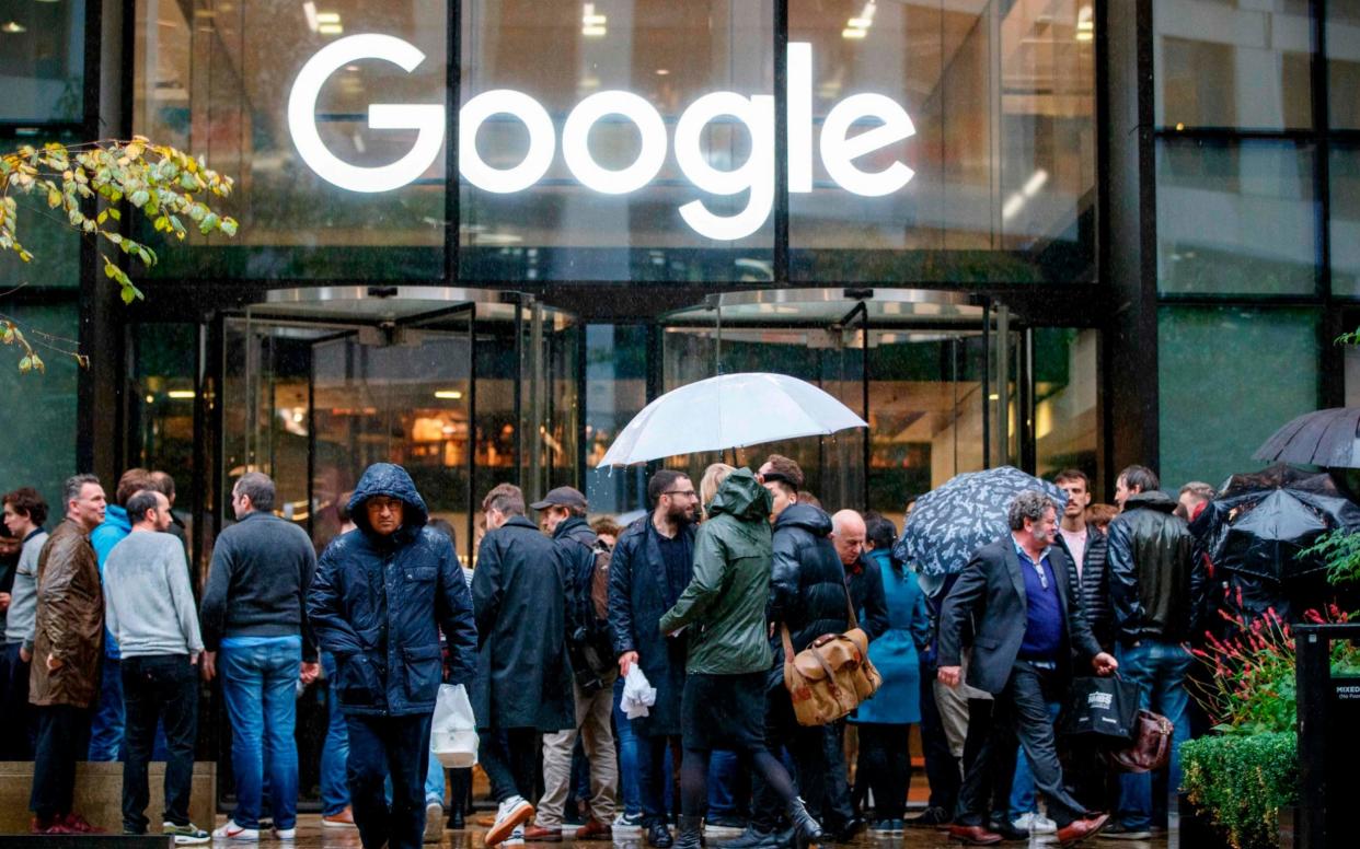 Google staff stage a walkout at the company's UK headquarters in London on November 1, 2018 as part of a global campaign over the US tech giant's handling of sexual harassment. - AFP