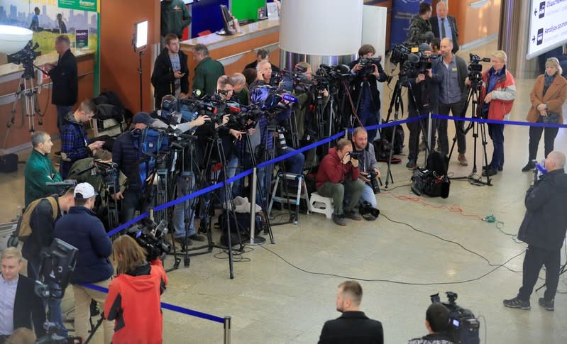 Journalists wait for convicted Russian agent Butina deported after U.S. jail release at an airport outside Moscow