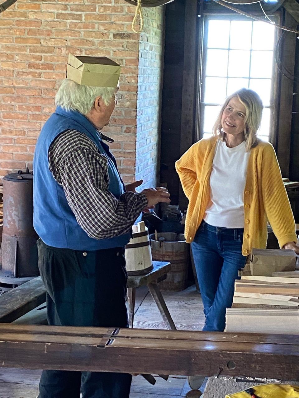 At Genesee Country Village and Museum in Mumford, TV travel host Samantha Brown worked with the museum's cooper to make a wooden bucket.