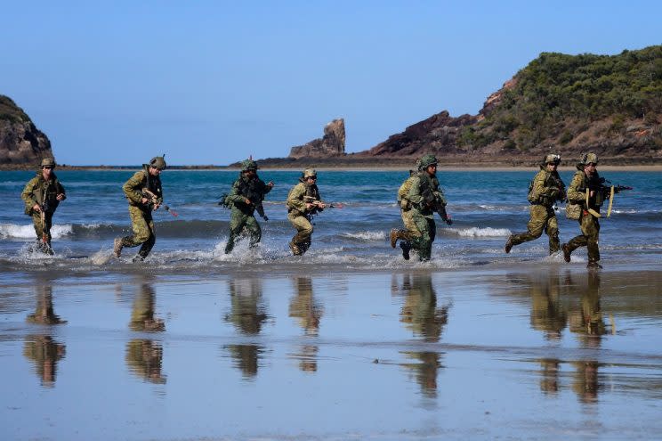 Members of Singapore Armed Forces and Australian Defence Force land on the beach during a preview of Exercise Trident, part of Exercise Wallaby, at Freshwater Bay in Rockhampton, Queensland, in 2014 (AFP Photo)