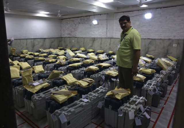 An election official checks electronic voting machines