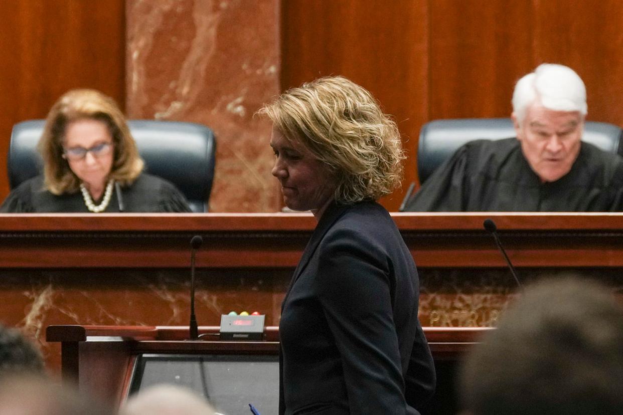 Beth Klusmann of the Texas attorney general's office takes a seat after giving oral arguments on behalf of the state and the Texas Medical Board at the Texas Supreme Court in Zurawski v. State of Texas in November. The plaintiffs, 20 women who were denied abortions despite severe pregnancy complications and two OB-GYNs suing on behalf of their patients, were demanding that the state clarify medical exceptions to its near-total abortion ban.