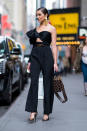 <p>The Rhode Island native seems unbothered by New York’s winter weather in a one-sleeved jumpsuit. (Photo: Getty Images) </p>