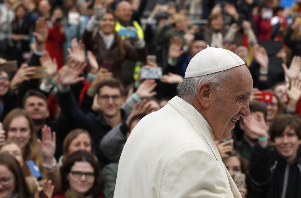 Pope Francis greets the crowd on his Popemobile as he arrives for a meeting with youths at the Cathedral Square in Vilnius, Lithuania, Saturday Sept. 22, 2018. (AP Photo/Mindaugas Kulbis)