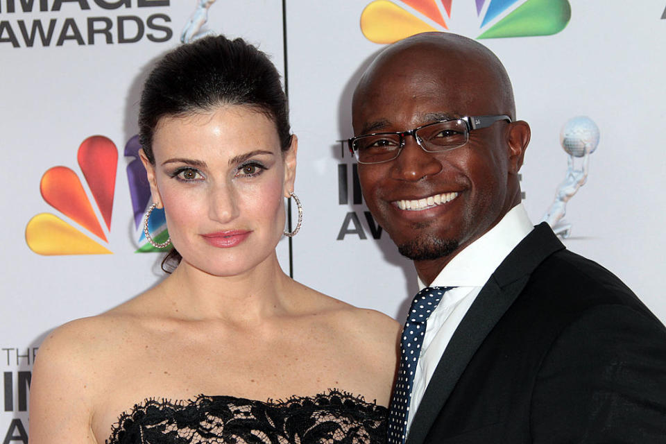 Close-up of Idina and Taye smiling at a media event