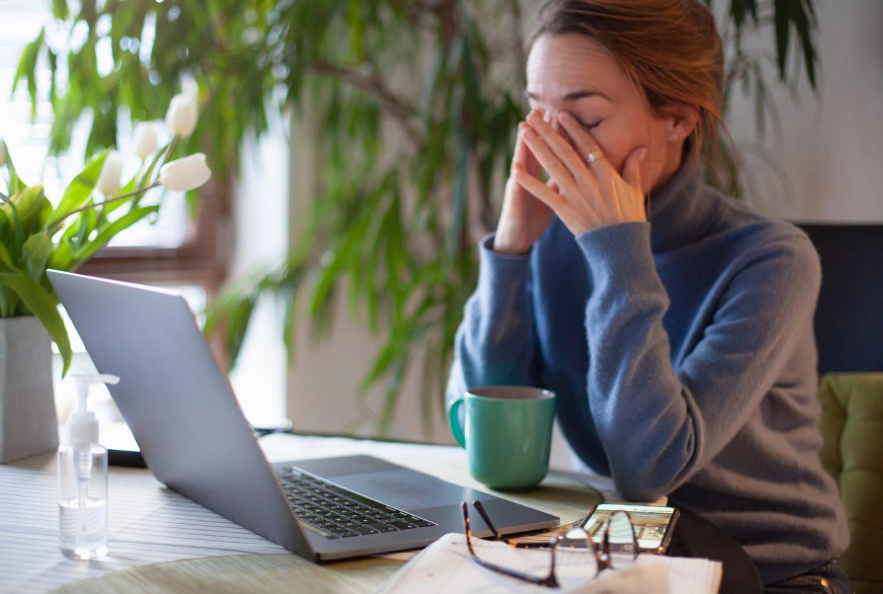 Woman rubbing her eyes in front of laptop. Working in home office during Covid-19 lockdown. - Copyright: Kathrin Ziegler/getty images