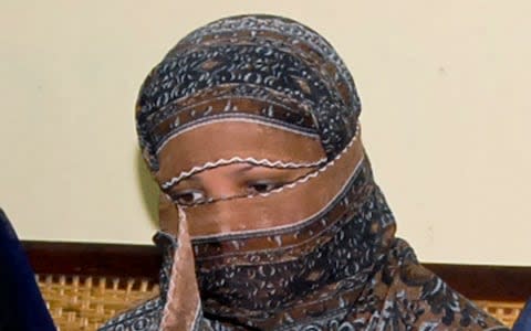 n this Nov. 20, 2010, file photo, Asia Bibi, a Pakistani Christian woman, listens to officials at a prison in Sheikhupura near Lahore, Pakistan. Pakistan's Supreme Court has postponed its ruling on the final appeal of Bibi who has been on death row since 2010 after being convicted of blasphemy against Islam. - Credit: AP