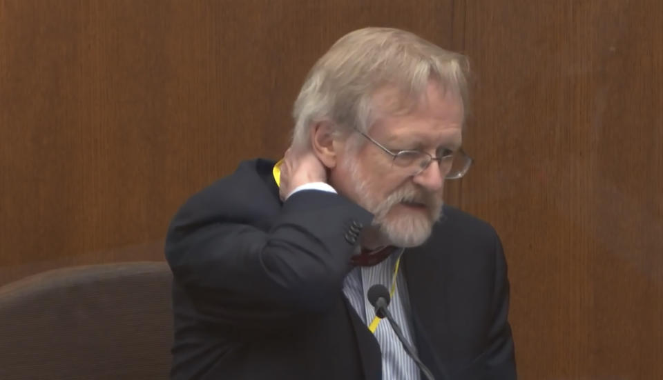In this image from video, Dr. Martin Tobin testifies as Hennepin County Judge Peter Cahill presides Thursday, April 8, 2021, in the trial of former Minneapolis police Officer Derek Chauvin at the Hennepin County Courthouse in Minneapolis, Minn. Chauvin is charged in the May 25, 2020 death of George Floyd. (Court TV via AP, Pool)