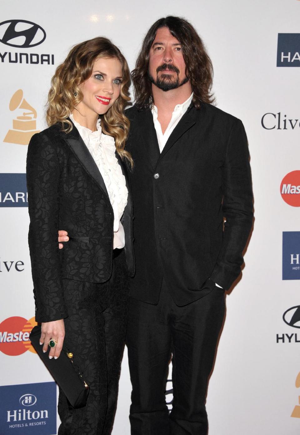 Recording artist Dave Grohl, right, and Jordyn Blum arrive at the Clive Davis Pre-GRAMMY Gala on Saturday, Feb. 9, 2013 in Beverly Hills, Calif. (Photo by John Shearer/Invision/AP)