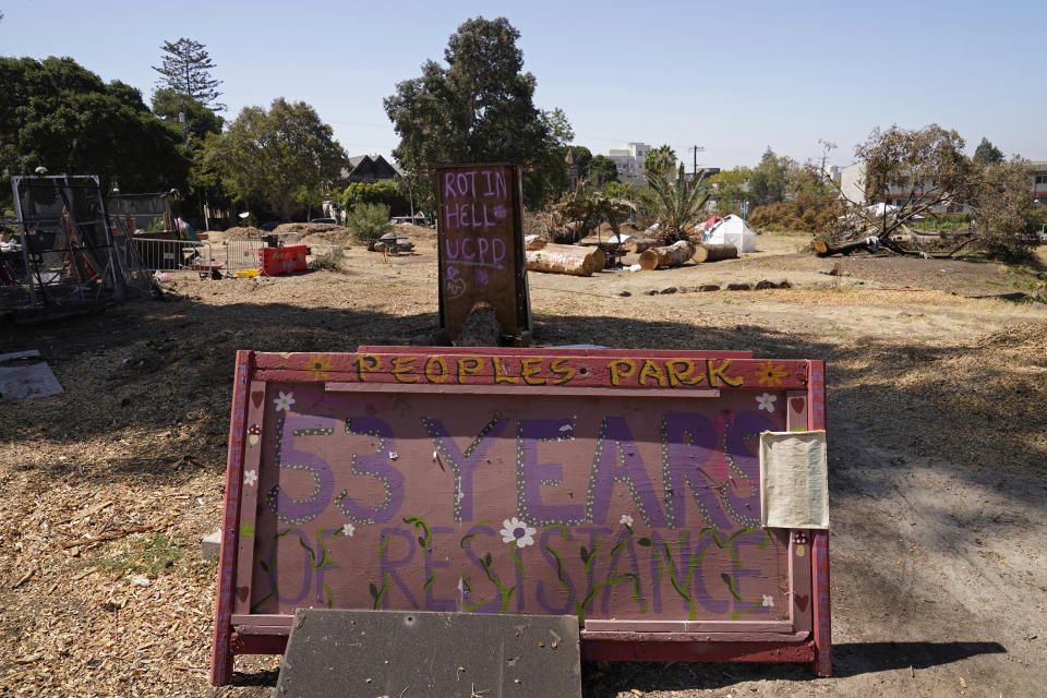 A sign marks 53 years of resistance at People's Park in Berkeley, Calif., Tuesday, Aug. 16, 2022. The three-acre site's colorful history, forged from University of California, Berkeley's seizure of the land in 1968, has been thrust back into the spotlight by the school's renewed effort to pave over People's Park as part of a $312 million project that includes sorely needed housing for about 1,000 students. (AP Photo/Eric Risberg)