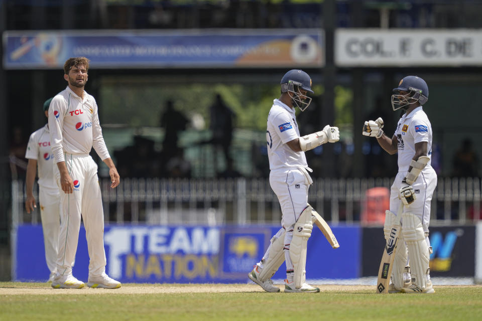 Pakistan's Shaheen Shah Afridi, left, reacts after Sri Lanka's Nishan Madushka and Dimuth Karunaratne cheer each others during the fourth day of the second cricket test match between Sri Lanka and Pakistan in Colombo, Sri Lanka on Thursday, Jul. 27. (AP Photo/Eranga Jayawardena)