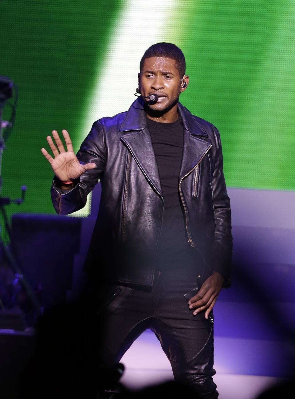 Usher performs during the Kids' Inaugural: Our Children. Our Future." event in Washington, Saturday, Jan. 19, 2013. (AP Photo/Frank Franklin II)