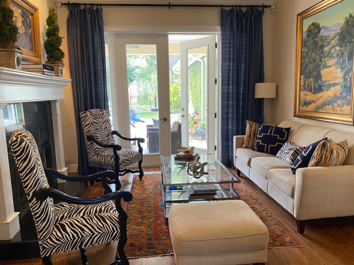 THE ANIMAL WITHIN: A glossy coat of black paint and some exotic new fabric gave these dated tapestry chairs a lively new look and a new life