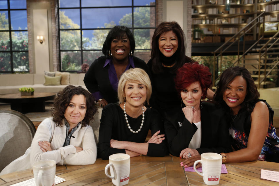 In this Monday, Jan. 4, 2014 photo released by CBS, actress Sharon Stone, second right, sits down with the hosts, from left, Sara Gilbert, Sheryl Underwood, Sharon Stone, Julie Chen, and Aisha Tyler of "The Talk." Tyler is a regular panelist on the CBS' show. She is also the voice of agent Lana Kane on FX animated series, "Archer," the fifth season of which premiered this week. (AP Photo/CBS, Cliff Lipson)