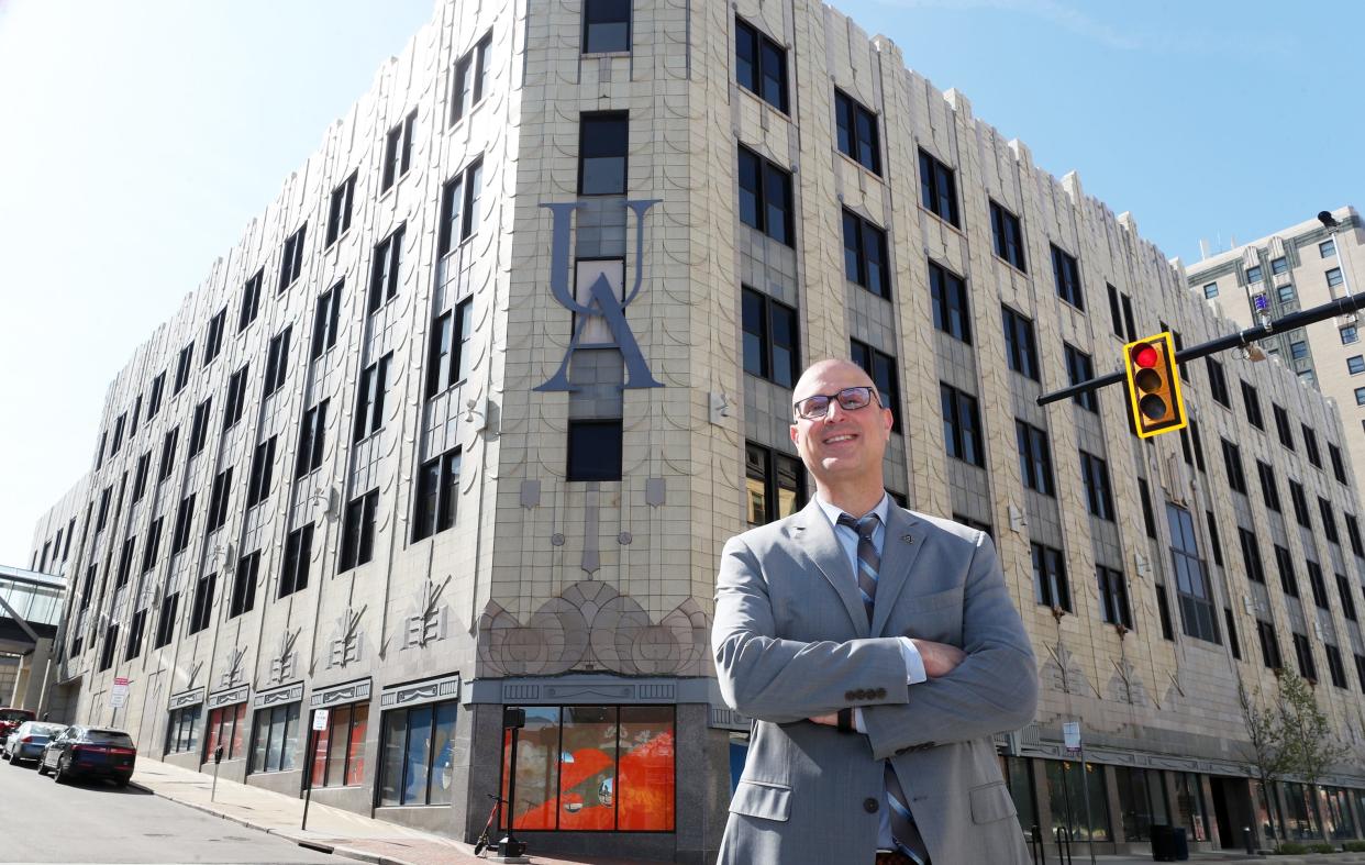Jason Segedy, former planning director for the city of Akron, is now serving as the project manager of a $40 million overhaul of the University of Akron's Polsky building, which takes up a full block of Akron's Main Street.