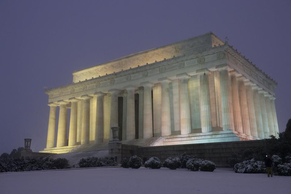 The Lincoln Memorial is seen under snowfall in Washington on January 22, 2016. Thousands of flights were cancelled and supermarket shelves were left bare Friday as millions of Americans hunkered down for a winter storm expected to dump historic amounts of snow in the eastern United States.