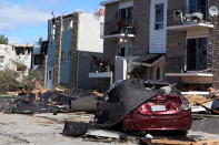 <p>A damaged car and apartment buildings are shown in a Gatineau, Que. neighbourhood on Saturday, September 22, 2018. A tornado on Friday afternoon tore roofs off of homes, overturned cars and felled power lines in the Ottawa community of Dunrobin and in Gatineau, Que. (Photo from Fred Chartrand/The Canadian Press) </p>