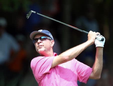 PGA golfer Davis Love III tees off with an iron during practice for the 2014 PGA Championship at Valhalla Country Club Louisville, KY, USA in this file photo taken on Aug 6, 2014; Mandatory Credit: Brian Spurlock-USA TODAY Sports