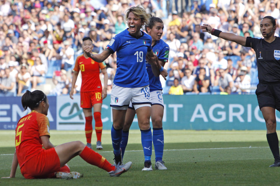 Italy's Valentina Giacinti, center, celebrates after scoring her side's first goal during the Women's World Cup round of 16 soccer match between Italy and China at Stade de la Mosson in Montpellier, France, Tuesday, June 25, 2019. (AP Photo/Claude Paris)