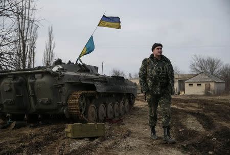 A Ukrainian serviceman is pictured at his position near Debaltseve, eastern Ukraine, February 8, 2015. REUTERS/Gleb Garanich