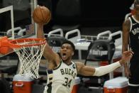 Milwaukee Bucks' Giannis Antetokounmpo dunks during the second half of Game 4 of the NBA Eastern Conference basketball semifinals game against the Brooklyn Nets Sunday, June 13, 2021, in Milwaukee. (AP Photo/Morry Gash)