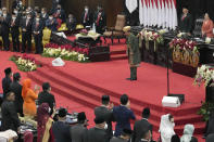 Indonesian President Joko Widodo takes a bow after delivering his annual State of the Nation Address ahead of the country's Independence Day, at the parliament building in Jakarta, Indonesia, Tuesday, Aug. 16, 2022. (AP Photo/Tatan Syuflana, Pool)