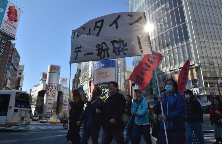 A group of Japanese protesters stage an anti-Valentine's Day demonstration march in Tokyo on February 12, 2017