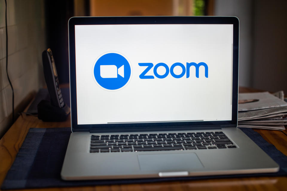 Pictured in the generic photo is the Zoom logo on a computer