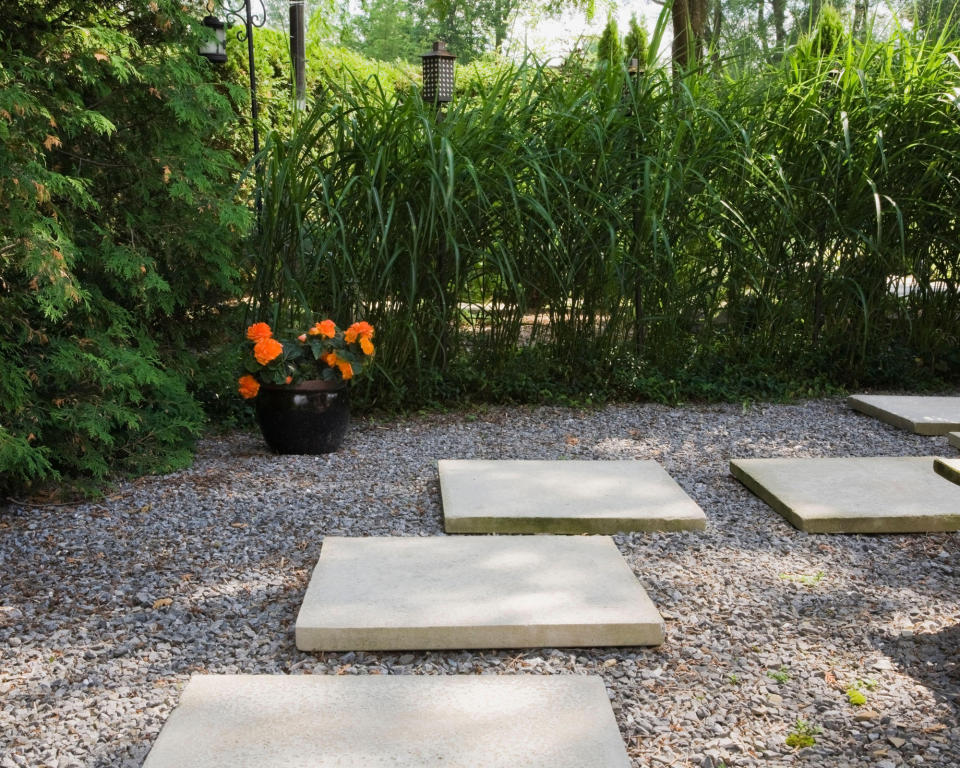 <p> This brilliant idea lies somewhere down the middle between garden path ideas and patio paving. Oversized concrete paving slabs have been laid on top of gravel in an informal path structure that gives a contemporary, floating effect. Very easy to achieve even for a beginner and looks smart without being overly formal.&#xA0; </p>