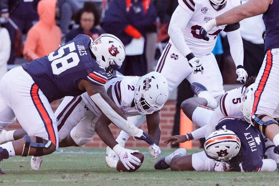 FILE - Mississippi State linebacker Tyrus Wheat (2) recovers a fumble by Auburn quarterback TJ Finley (1) during the second half of an NCAA college football game Saturday, Nov. 13, 2021, in Auburn, Ala. Memphis plays Mississippi State on Sept. 3. (AP Photo/Butch Dill, File)