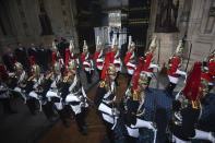 Members of the Household Cavalry parade through the Sovereign's entrance ahead of the State Opening of Parliament by Queen Elizabeth II, in the House of Lords at the Palace of Westminster in London, Thursday Dec. 19, 2019. (Victoria Jones, Pool via AP)