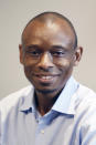 Fifth Congressional District candidate, Democrat Antone Melton-Meaux, poses after an interview in his Minneapolis office Wednesday, July 22, 2020. Melton-Meaux is giving Democrat Rep. Ilhan Omar an unexpectedly strong, well-funded primary challenge in one of the country's most heavily Democratic congressional districts, which includes Minneapolis and some suburbs. (AP Photo/Jim Mone)