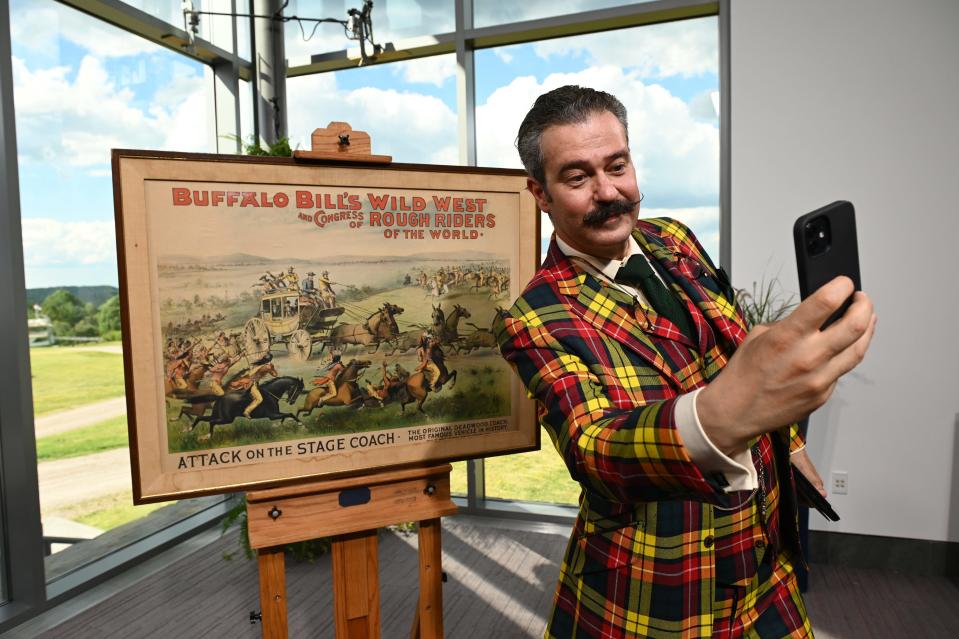 Appraiser Nicholas D. Lowry poses in front of a piece of Buffalo Bill memorabilia during the "Antiques Roadshow" season 27 tour at the Shelburne Museum on July 12, 2022.