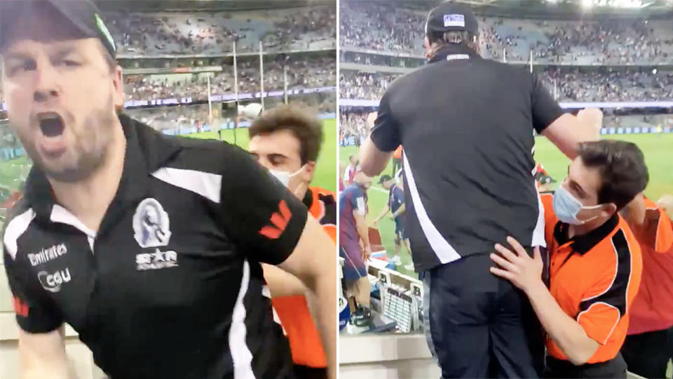 The Collingwood fan, pictured here having to be held back by security.