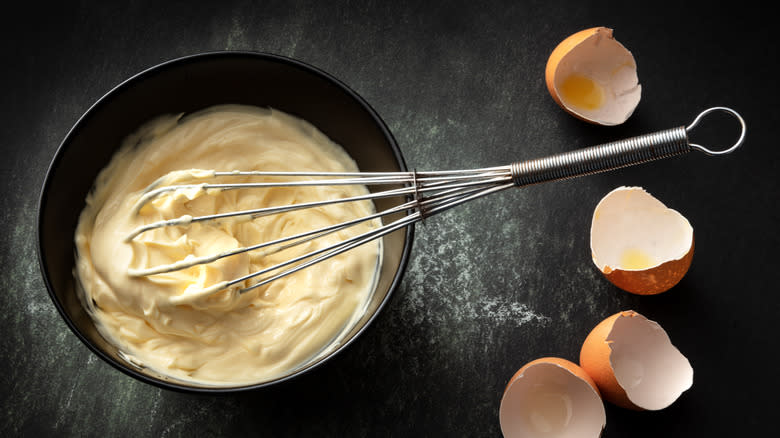 mayonnaise with whisk and egg shells