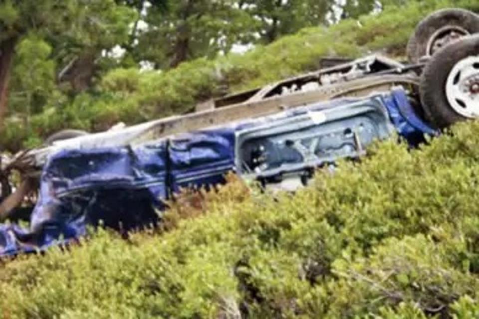 The mangled wreckage of Peter Bergna’s car after it had fallen down the side of a mountain in Nevada with his wife inside (Washoe County Sheriff)