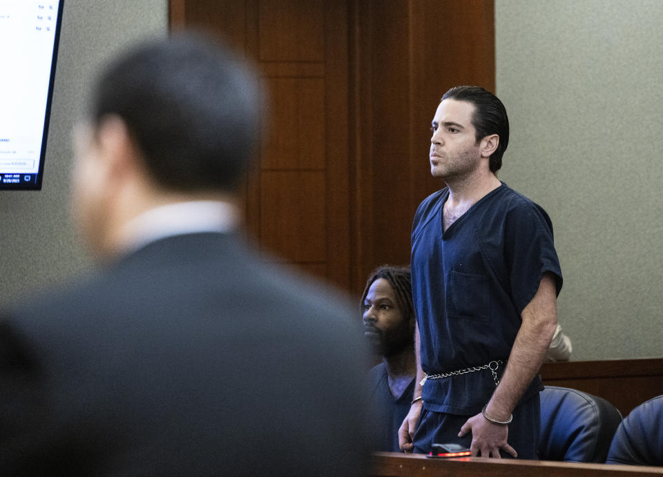 Matthew Mannix, accused of holding a woman hostage and throwing furniture out of a Caesars Palace hotel room, listens as Max Anderson, left, a prosecutor, addresses the court during Mannix sentencing at the Regional Justice Center, on Thursday, Sept. 28, 2023, in Las Vegas. (Bizuayehu Tesfaye/Las Vegas Review-Journal via AP)