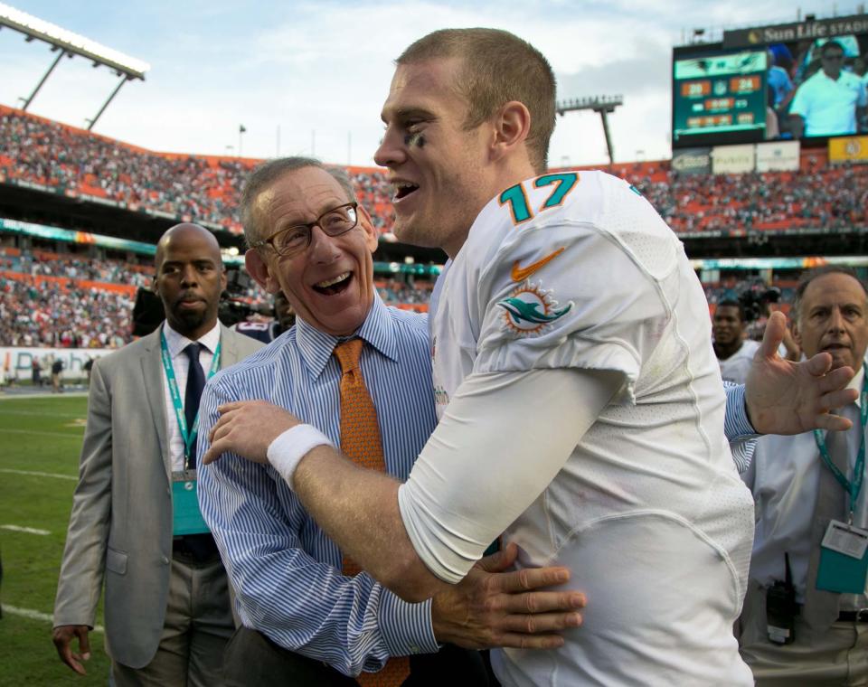 Miami Dolphins owner Stephen Ross congratulates Miami Dolphins quarterback Ryan Tannehill (17) after win over the Patriots at Sun Life Stadium in Miami Gardens, Florida on December 15, 2013.