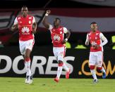 Yamilson Rivera (C) of Colombia's Santa Fe celebrates a goal with teammates Yerry Mina Gonzalez (L) and Wilson Morelo after scoring against Argentina's Estudiantes de La Plata during their Copa Libertadores soccer match in Bogota, Colombia May 12, 2015. REUTERS/Jose Miguel Gomez