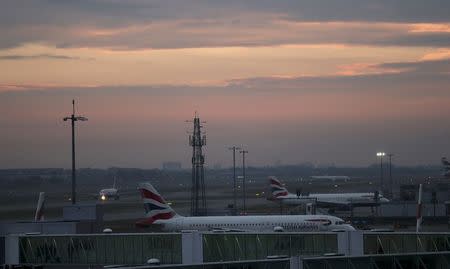 Aircraft taxi in the early morning at Heathrow airport in west London, Britain October 25, 2016. REUTERS/Eddie Keogh